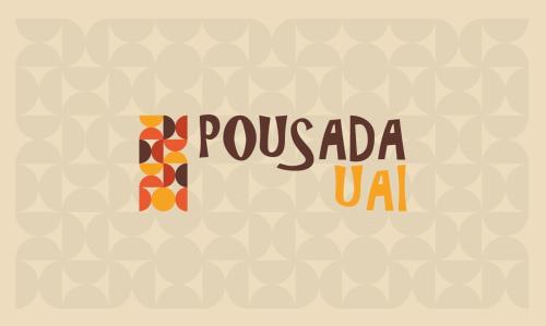 a sign that reads pueblo usa with a pattern at Pousada Uai Tiradentes in Tiradentes
