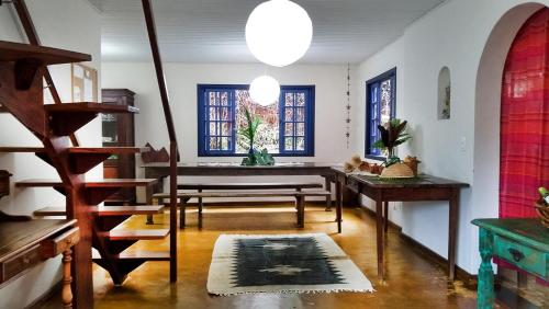 a living room filled with furniture and a window at Sitio Flor das Aguas in Lumiar