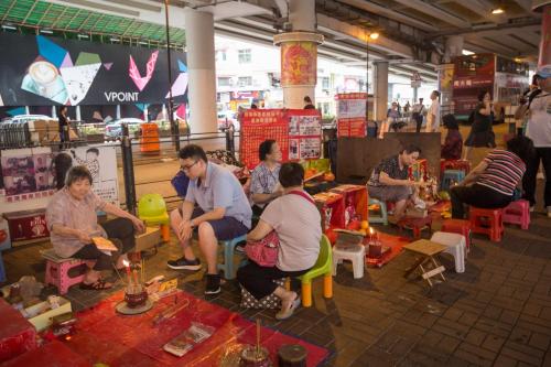a group of people sitting in chairs in a store at Holiday Inn Express Hong Kong Causeway Bay by IHG in Hong Kong
