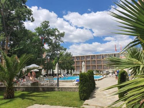 a resort with a swimming pool and a building at Hotel Riva Park - All Inclusive in Sunny Beach