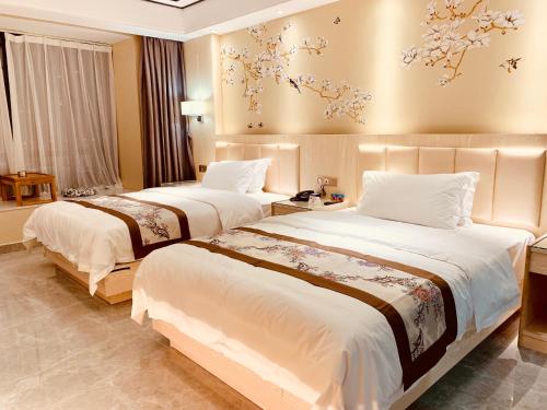 Ένα ή περισσότερα κρεβάτια σε δωμάτιο στο Youngsun Hotel
