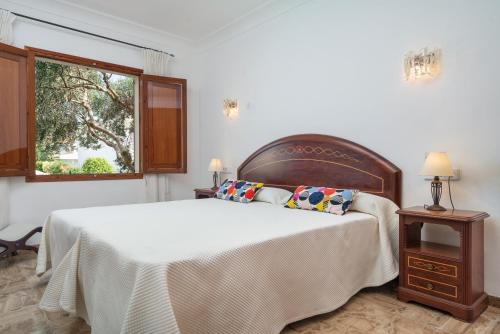 En eller flere senge i et værelse på Villa Bugambilia
