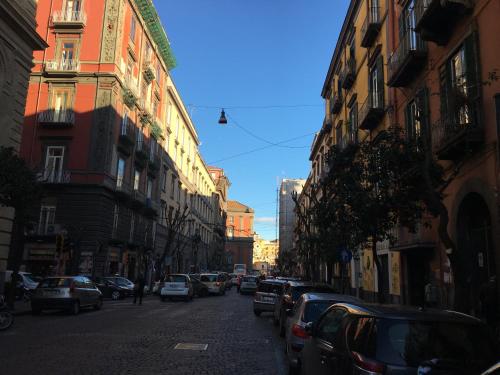 a city street with parked cars and buildings at Resort CostantiNapoli 27 in Naples