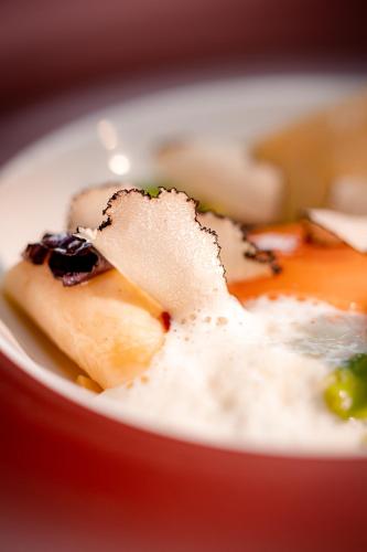 a bowl of food on a table at Parkhotel Herne in Herne