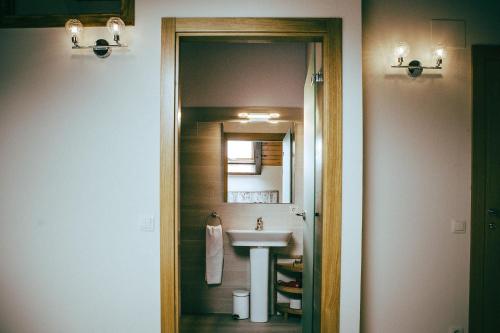 a bathroom with a sink and a mirror at hostal iratibizkar in Ochagavía