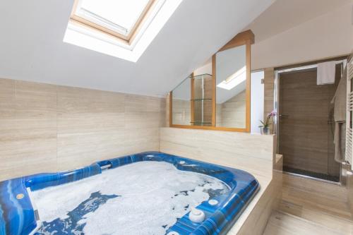 a large blue tub in a room with a window at Eurohotel in Milan