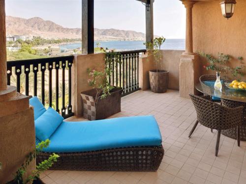 
a living room with a couch and a table at Mövenpick Resort & Residences Aqaba in Aqaba

