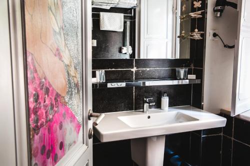 a bathroom with a sink and a mirror at Prijeko Palace in Dubrovnik