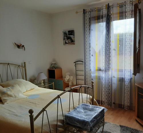 En eller flere senge i et værelse på La Palatine chambre chez l habitant à 20 mn de Rodez
