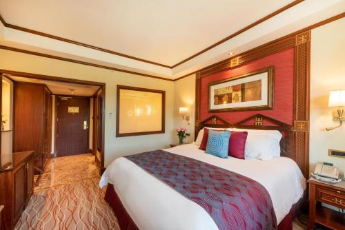a bedroom with a large bed in a room at Nairobi Serena Hotel in Nairobi