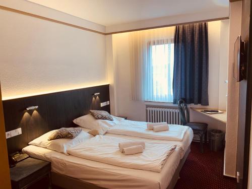 Postel nebo postele na pokoji v ubytování Hotel Kunibert der Fiese - Superior