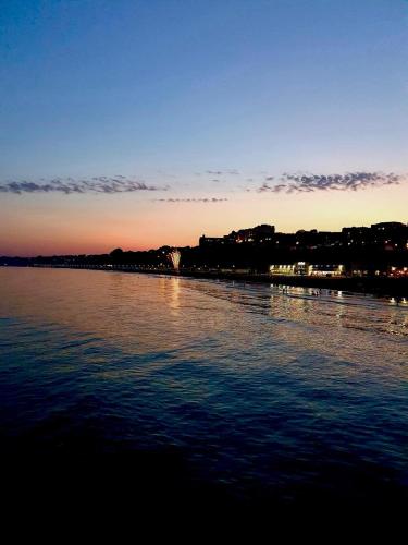 a large body of water with a city in the background at The Hedley Townhouse in Bournemouth