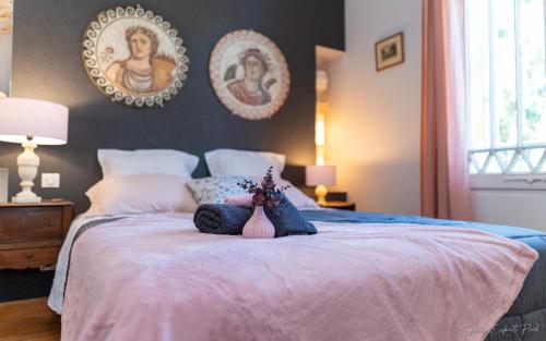 a little girl is laying on a bed at I love Bergerac in Bergerac