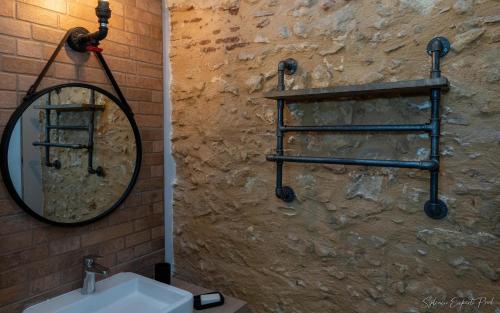a bathroom with a mirror and a sink at I love Bergerac in Bergerac