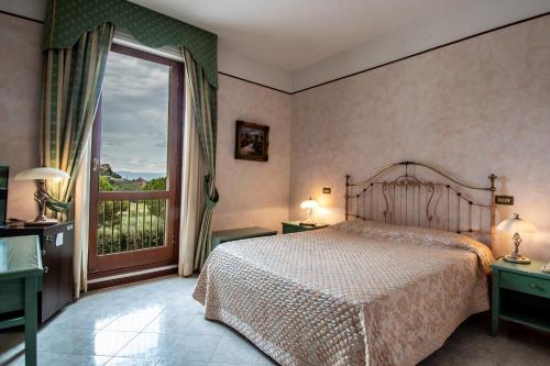 Postel nebo postele na pokoji v ubytování Fortuna Resort