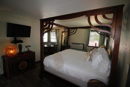 מיטה או מיטות בחדר ב-Balinese Cottages