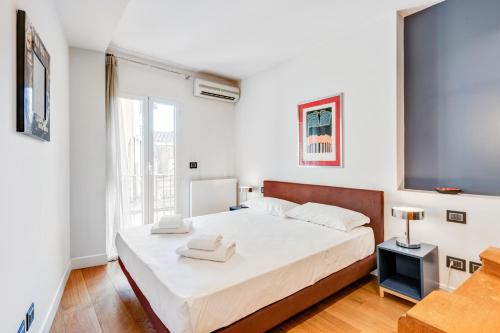 Posteľ alebo postele v izbe v ubytovaní Piazza Santa Croce Design Apartment with Balcony