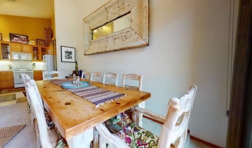 a dining room with a wooden table and chairs at Snowcreek #760 condo in Mammoth Lakes