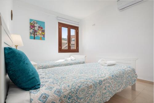 Postelja oz. postelje v sobi nastanitve Tamarels beach apartment in Pollensa