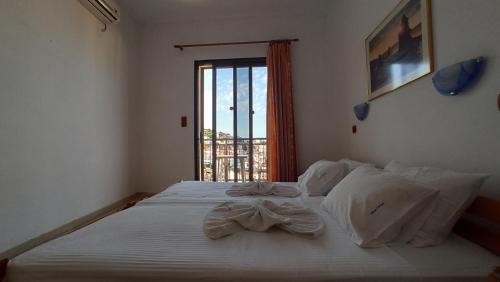 Postel nebo postele na pokoji v ubytování Denise Hotel