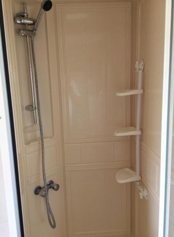 a shower stall in a bathroom with a shower at L&g caravan hire 8 BERTH SEALANDS FAMILYS ONLY AND THE LEAD PERSON MUST BE OVER 30 in Ingoldmells