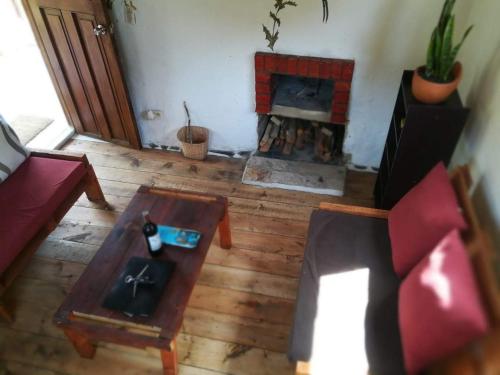 an overhead view of a living room with a fireplace at Jardin Colibri RNT 33633 in Guatavita