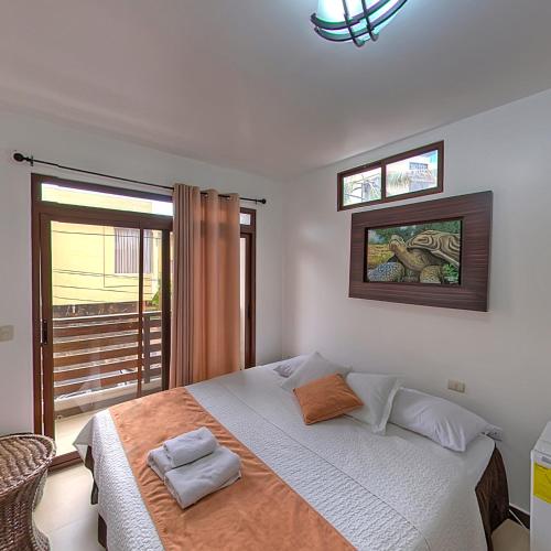 Katil atau katil-katil dalam bilik di Hostal Costa del Pacifico