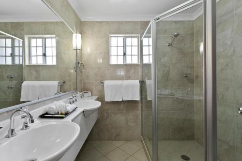a bathroom with a sink and a shower at Quality Inn Penrith Sydney in Penrith