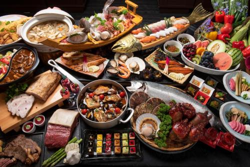 a table filled with lots of different types of food at Jodogahama Park Hotel in Miyako