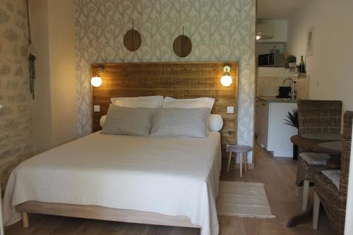 Ένα ή περισσότερα κρεβάτια σε δωμάτιο στο Terre de Bacchus