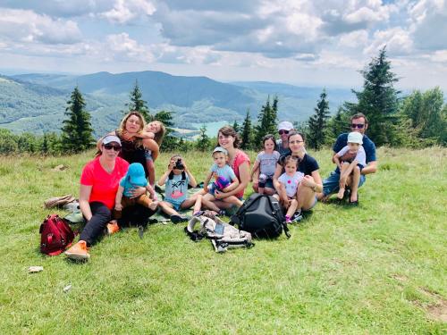 a group of people sitting on top of a hill at Conacul Secaria in Secăria