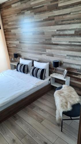 Postel nebo postele na pokoji v ubytování New Grey Residence Apartament