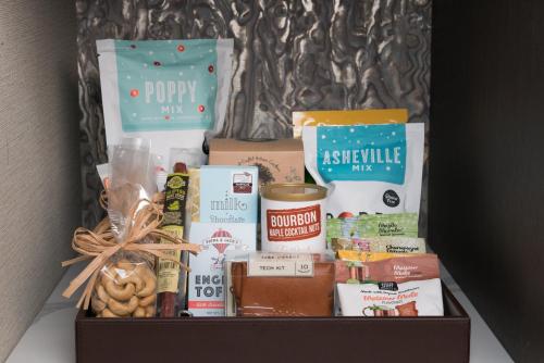 a box filled with food and othercellaneous food items at Kimpton Hotel Arras by IHG in Asheville