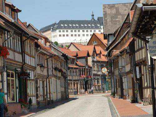 an empty street in an old town with buildings at Ferienhaus Haus am Wald in Stolberg i. Harz