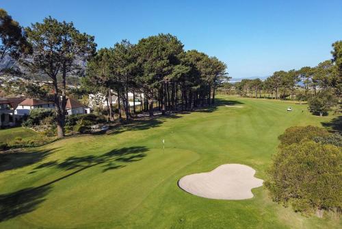 an overhead view of a golf green with a heart cut into it at Hermanus Lodge on the Green - Solar Power in Hermanus