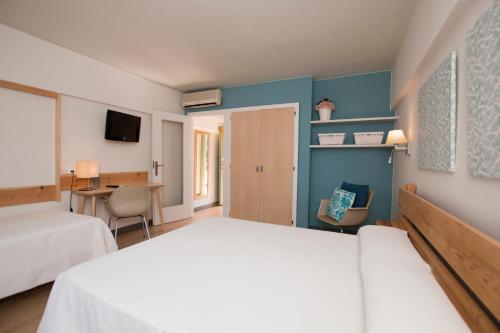 En eller flere senge i et værelse på Hotel Yola