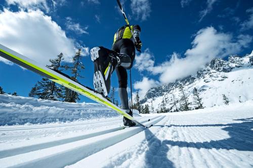 a person is on skis in the snow at das Bergerleben in Sonnenalpe Nassfeld