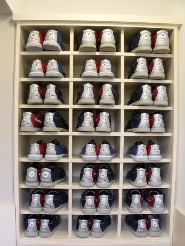 a closet filled with lots of shoes at La Contessa Castle Hotel in Szilvásvárad