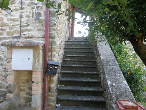 a set of stairs leading up to a building at La Cuccia - La Villa-San Pacrazio in Ambra