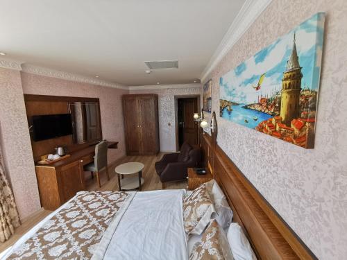 a bedroom with a bed and a living room at Perapolis Hotel in Istanbul