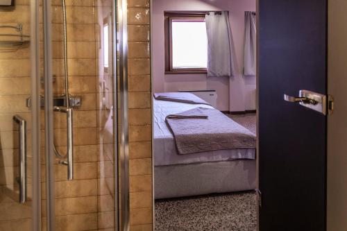 Un ou plusieurs lits dans un hébergement de l'établissement La Bella Verona Wine Suite