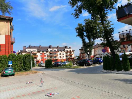 a person standing in the middle of a street at Pokoje Gościnne z łazienkami in Niepołomice