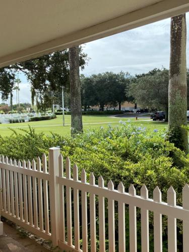 a white picket fence in front of a park at Orange County National Golf Center and Lodge in Orlando