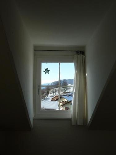 a window in a room with a view of a town at Gasthof Albergo Kreuzwirt in Fiè