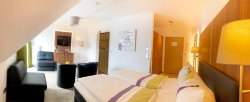 Een bed of bedden in een kamer bij Vakantiehotel Der Brabander
