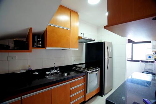 Virtuvė arba virtuvėlė apgyvendinimo įstaigoje Conforto em Campos