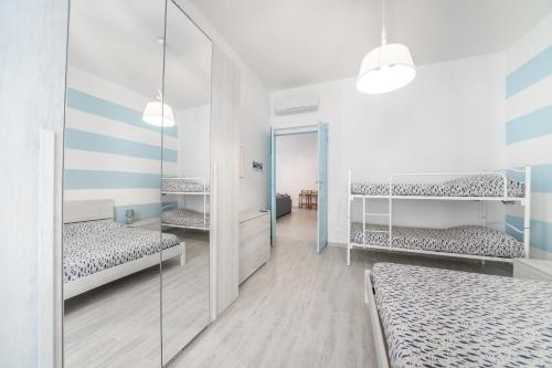 Postel nebo postele na pokoji v ubytování Gli appartamenti della Fra