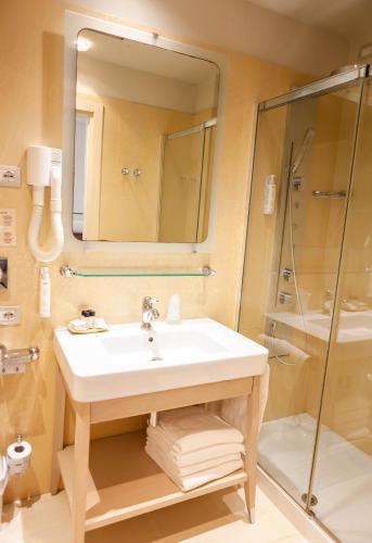 Um banheiro em Hotel Conchiglia