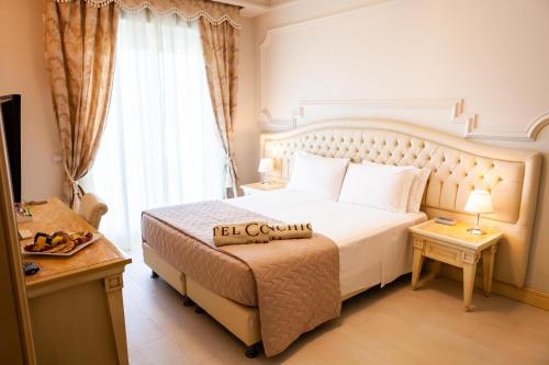 Cama ou camas em um quarto em Hotel Conchiglia