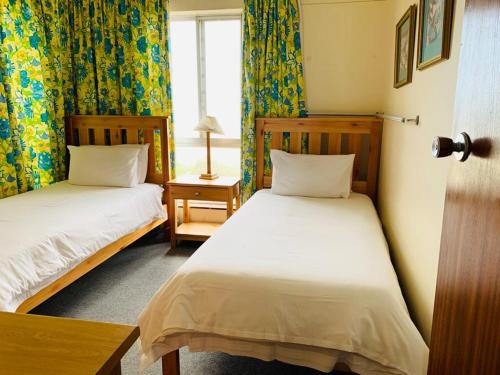 Ένα ή περισσότερα κρεβάτια σε δωμάτιο στο Santana Margates